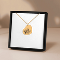 Pet Portrait Heart Necklace: gold heart pendant with a dog portrait engraving on a delicate chain.