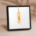 Custom name bar keychain in gold finish featuring personalized name 'Sophie' on a display.