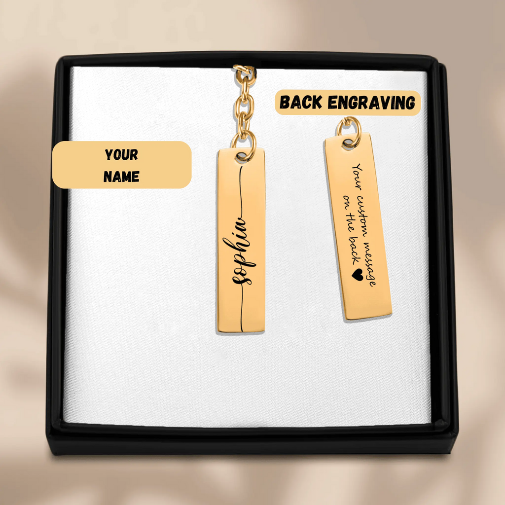 Custom name bar keychain displayed in sleek box with personalized name and back engraving option.