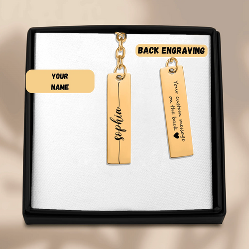 Custom name bar keychain displayed in sleek box with personalized name and back engraving option.