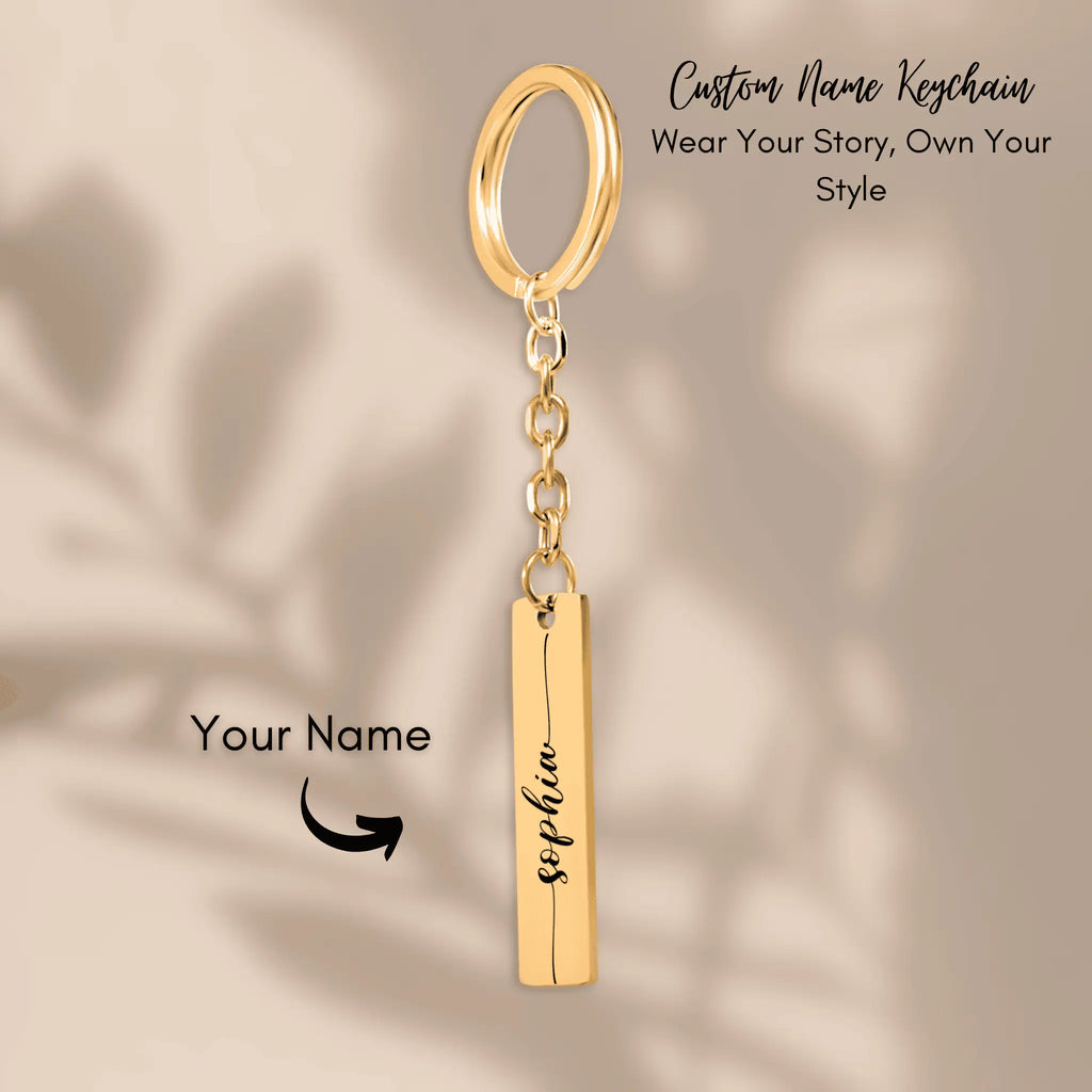 Custom name bar keychain in gold with personalized name pendant, showcasing stylish design and custom message option.