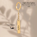 Custom name bar keychain in gold with personalized name pendant, showcasing stylish design and custom message option.